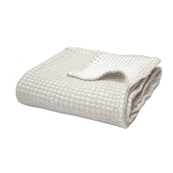 alt="Two-toned natural throw with a beautiful waffle texture"