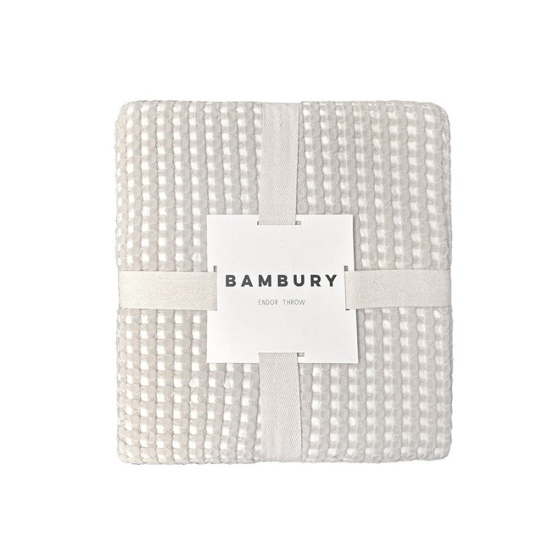 alt="Front view of a two-toned natural throw with a beautiful waffle texture"