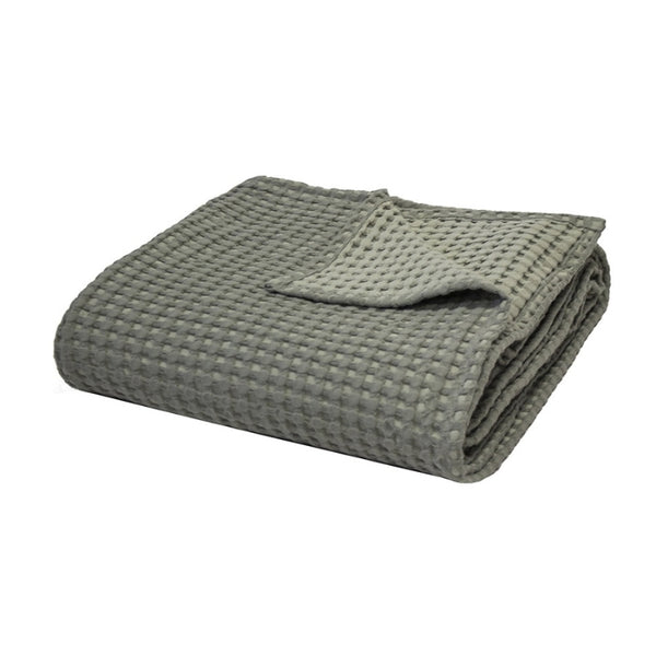 alt="Two-toned sage green throw with a beautiful waffle texture"