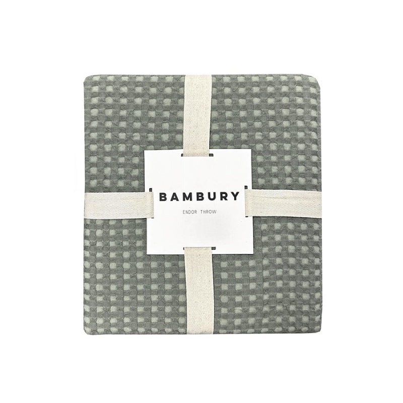 alt="Front view of a two-toned sage green throw with a beautiful waffle texture"