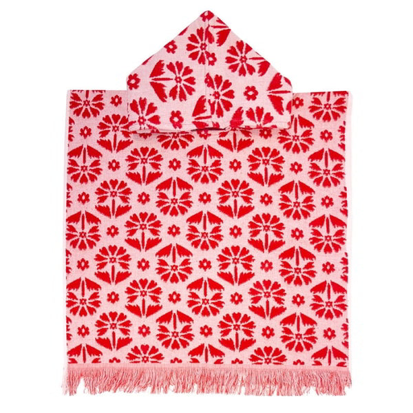 alt="Kids red poncho featuring a stylish floral pattern with knotted tassels along the ends"