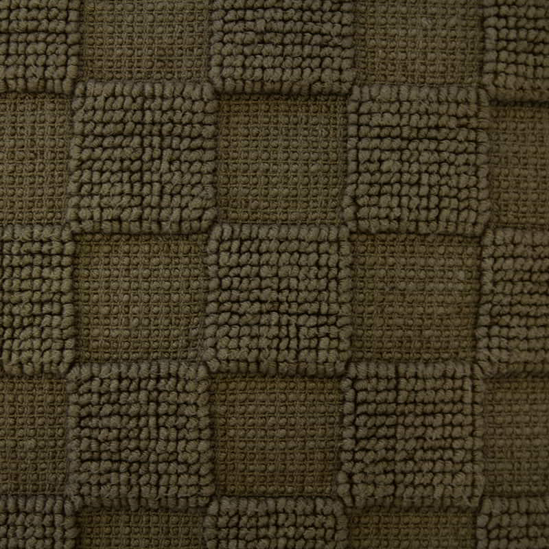 Detailed shot of a sophisticated olive cushion made from 100% cotton with checkerboard pattern. Features removable fill, machine washable for easy care.