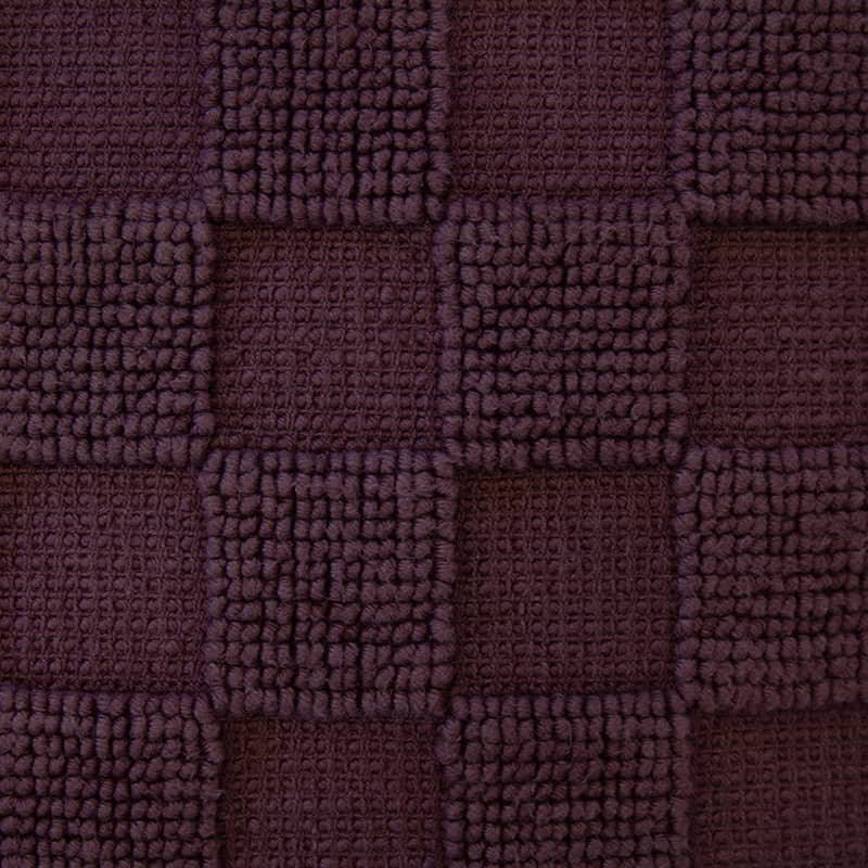 Detailed shot of a sophisticated maroon cushion made from 100% cotton with checkerboard pattern. Features removable fill, machine washable for easy care.