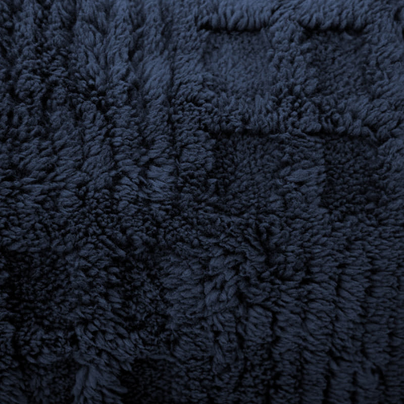Detail of the check pattern on the navy blue Lattice Blanket
