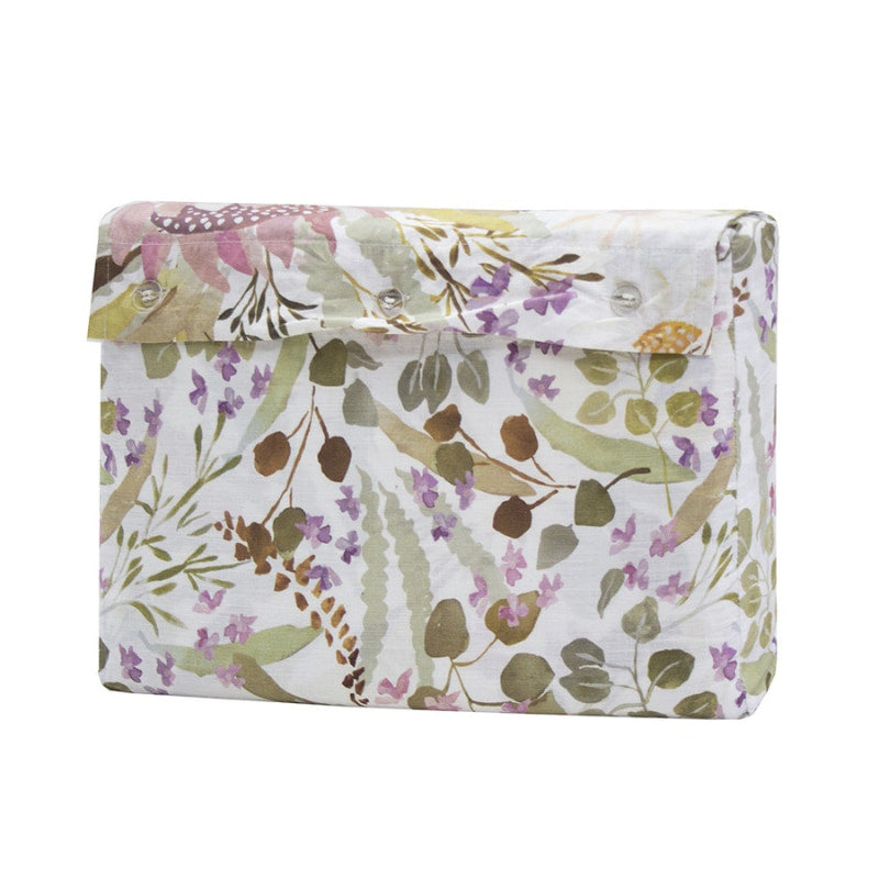 alt="A hand-painted, digitally printed quilt cover designed with a smaller scale floral print on the reverse inspired by the striking foliage of Australian flora in a packaging"