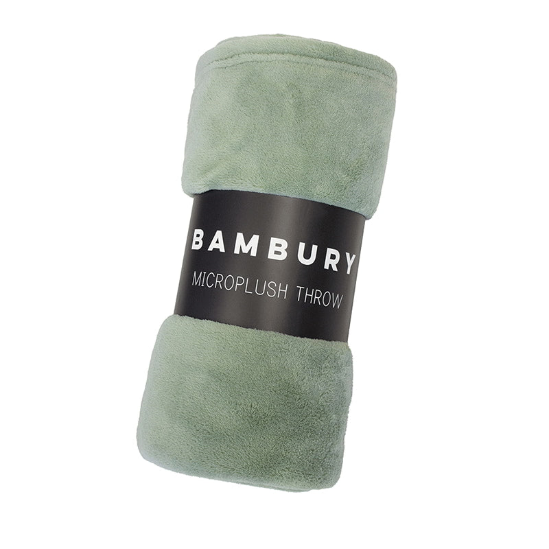Packaging details of a soft and snuggly large plush throw, 100% polyester, ideal for adding warmth on a bed or couch, durable and comfortable.