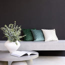 Monty Forest cushion styled on a modern bench with neutral cushions