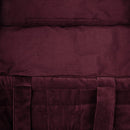 Inside detail of a large burgundy tote bag made from sumptuous cotton velvet featuring a quilted square pattern, cotton lining, and a pocket.