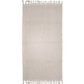alt="A stylish natural beach towel with a small check pattern achieved through a series of high and low sections of towelling finished with a beautiful fringe along the ends"