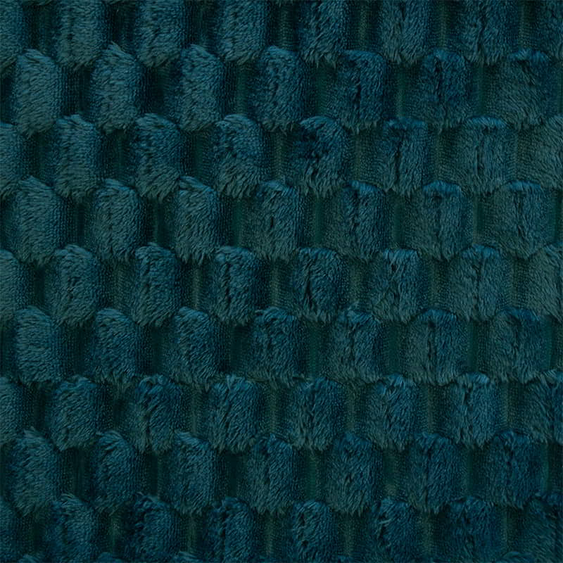 Details shot of a soft plush fabric with a cosy checkers pattern teal cushion is perfect for snuggling up on the couch.