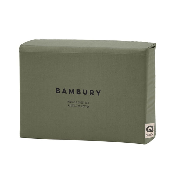 alt=A beautiful set of green cotton sheet set in packaging"