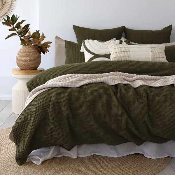 Transform your bedroom with our Samira quilt cover set in beautiful olive green, featuring a charming quilted square pattern.