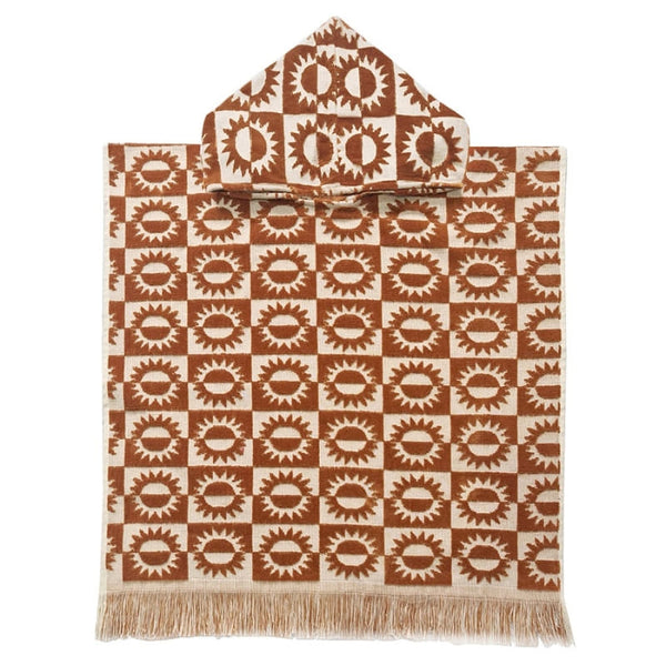 alt="Kids brown poncho featuring a stylish sun pattern with knotted tassels along the ends"