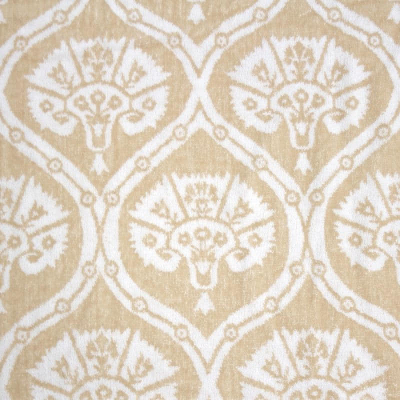 alt="Close-up view of a large sized towel features a contemporary design, with a velour finish on one side and natural fringing along the ends"