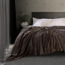 Luxuriously brown blanket from Bambury, perfect for adding warmth to your bed or snuggling up while relaxing on the couch.
