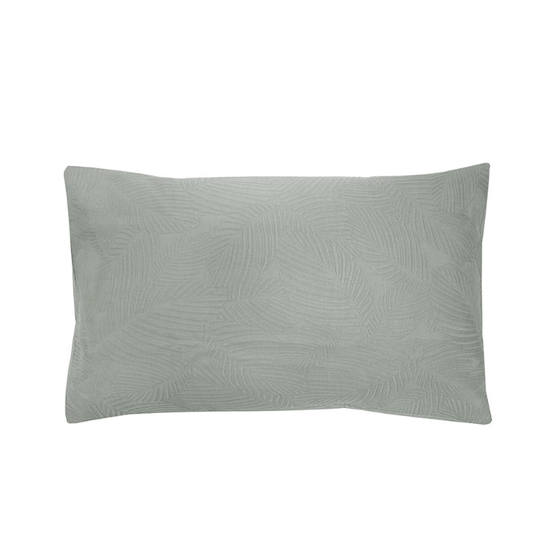 alt="A soft green tones pillowcase featuring a subtle textural leaf pattern"