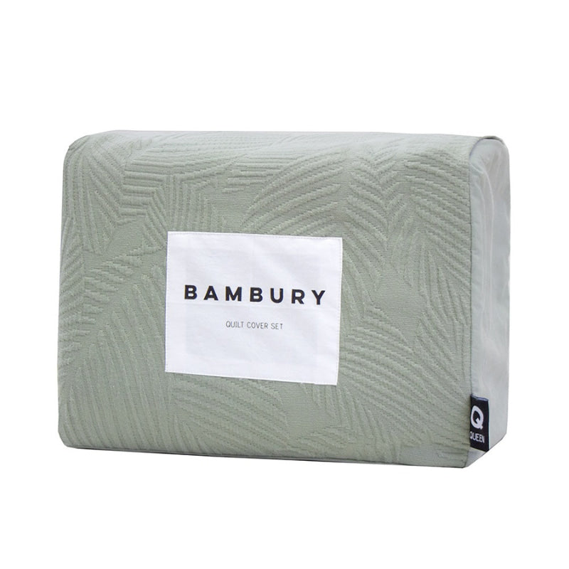 alt="A soft green tones quilt cover set featuring a subtle textural leaf pattern in a packaging"