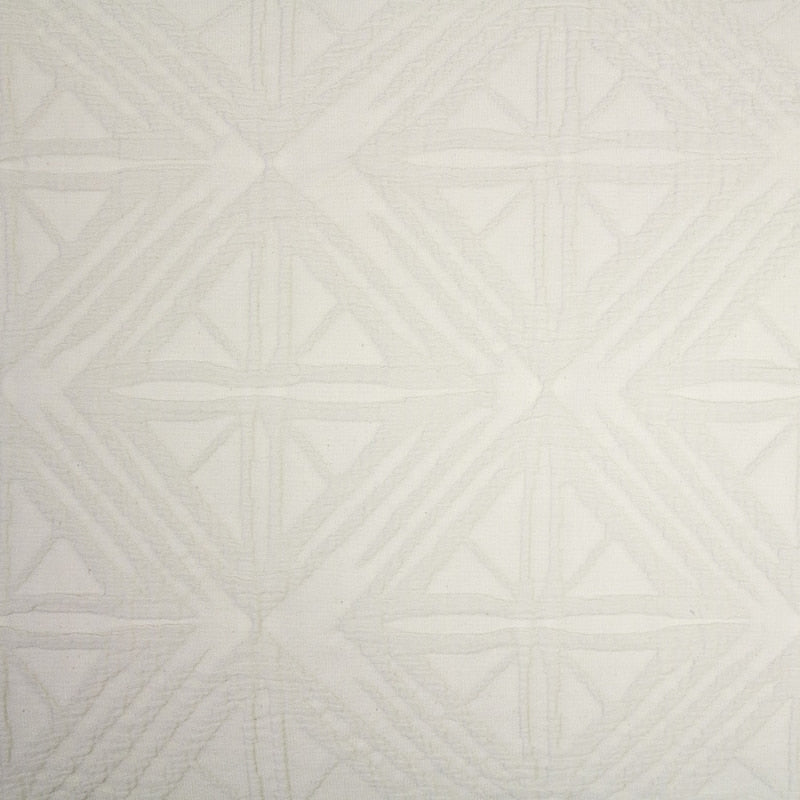 alt="Close-up view of a beautiful neutral stone colour european pillowcase featuring a geometric pattern"