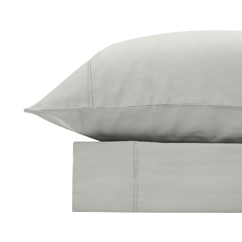 alt="A silver bamboo cotton sheet set featuring its minimal, inviting softness and comfort"