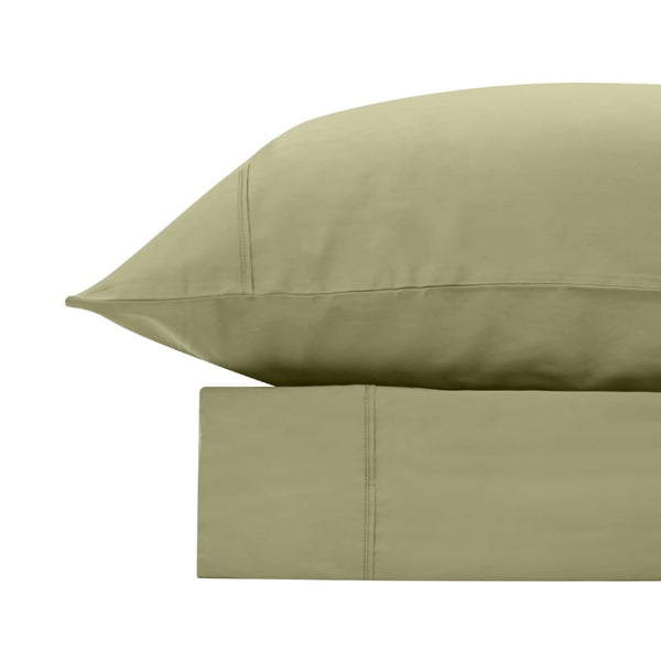 alt="An olive green bamboo cotton sheet set featuring its minimal, inviting softness and comfort"