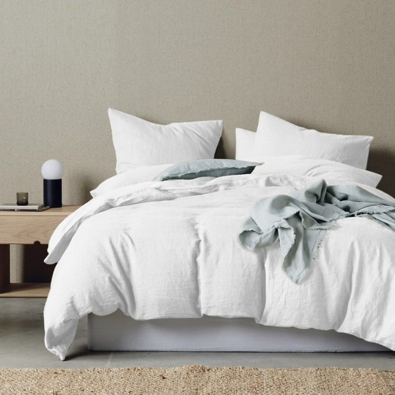 alt="Timeless elegance quilt cover set in a white colour scheme to your cosy bedroom"