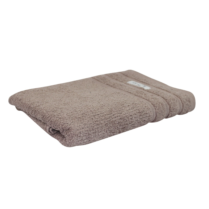alt="Actual folded details of coffee Bath towel featuring its finest Egyptian cotton and high level of softness."