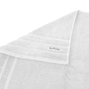 alt="Zoom in edge details of white bath towel featuring its finest egyptian cotton and high level of softness."