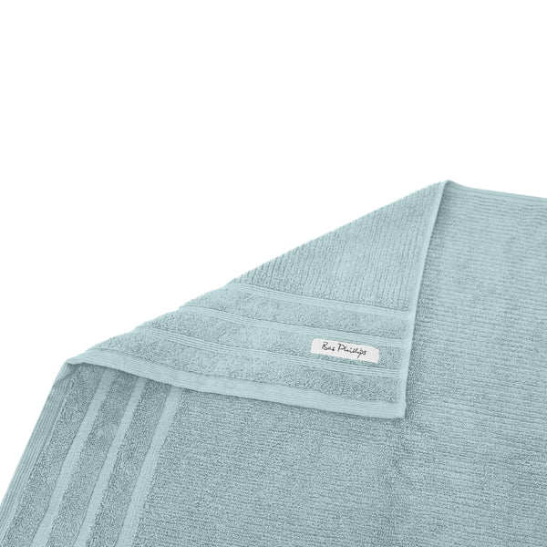 alt="A folded details of cairo egyptian cotton face washer in aqua colour featuring its minimal and soft details"