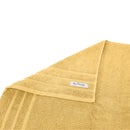 alt="A folded details of cairo egyptian cotton face washer in yellow colour featuring its minimal and soft details"