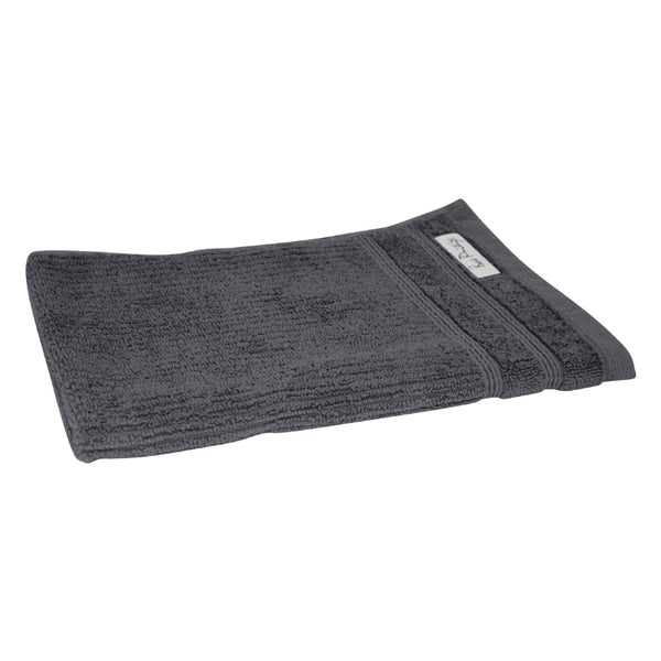 alt="An elegantly folded premium black hand towel, showcasing its minimal and soft details"