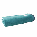 alt="A neatly rolled Aqua Spritz California bath towel showcasing its cottony texture and premium-quality cotton"