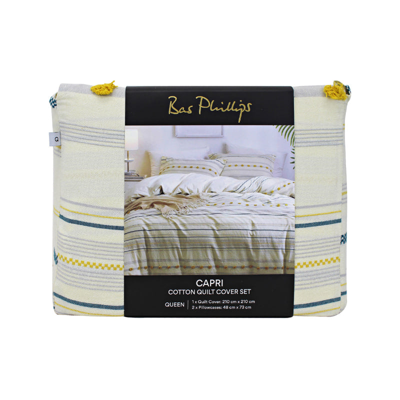 alt="Front details of a nice package of an elegant quilt cover set in a yellow hue feature a delightful tufted pom poms"