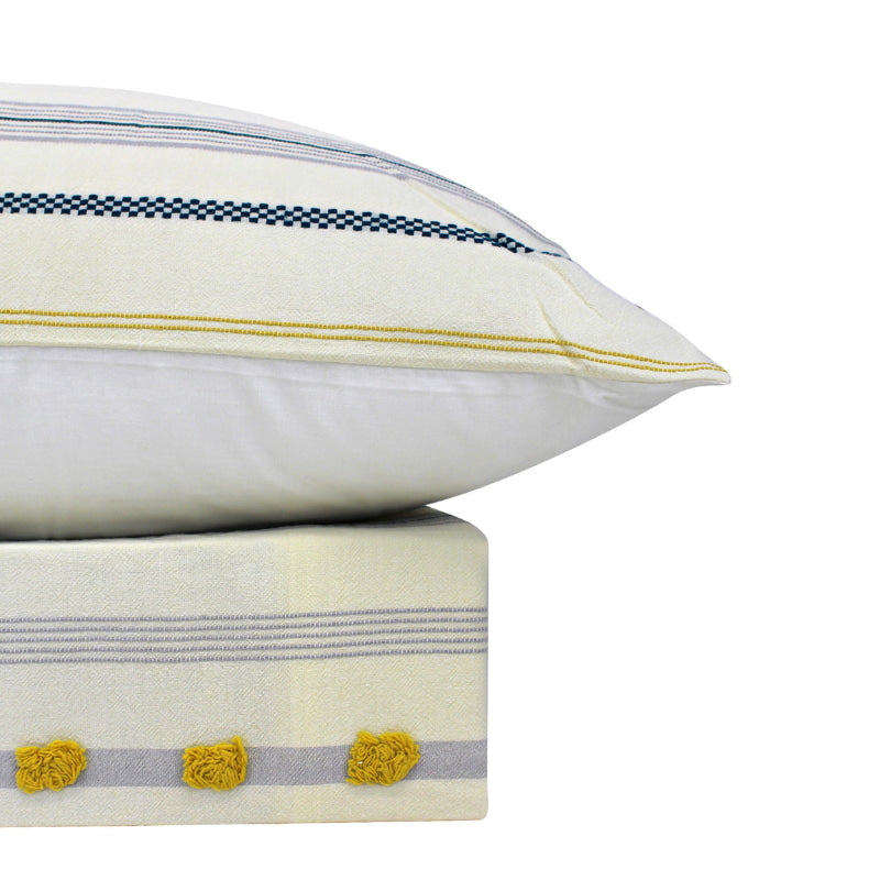 alt="An elegant quilt cover set in a yellow hue feature a delightful tufted pom poms with matching pillowcases"