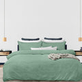 alt="Luxurious quilt cover set available in green hue featuring a subtle yet elegant design"