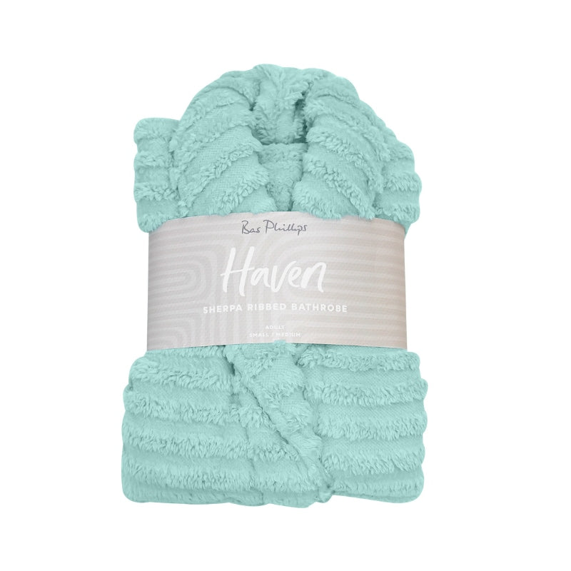 Packaging details of the blue Bas Phillips Haven Sherpa Ribbed Bathrobe which is a cloud-soft hug that offers ultimate comfort and stylish relaxation.