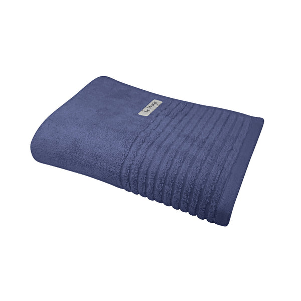 alt="A full photo details of a neatly folded indigo hayman bath towel showcasing its premium-quality zero twist cotton and inviting softness"