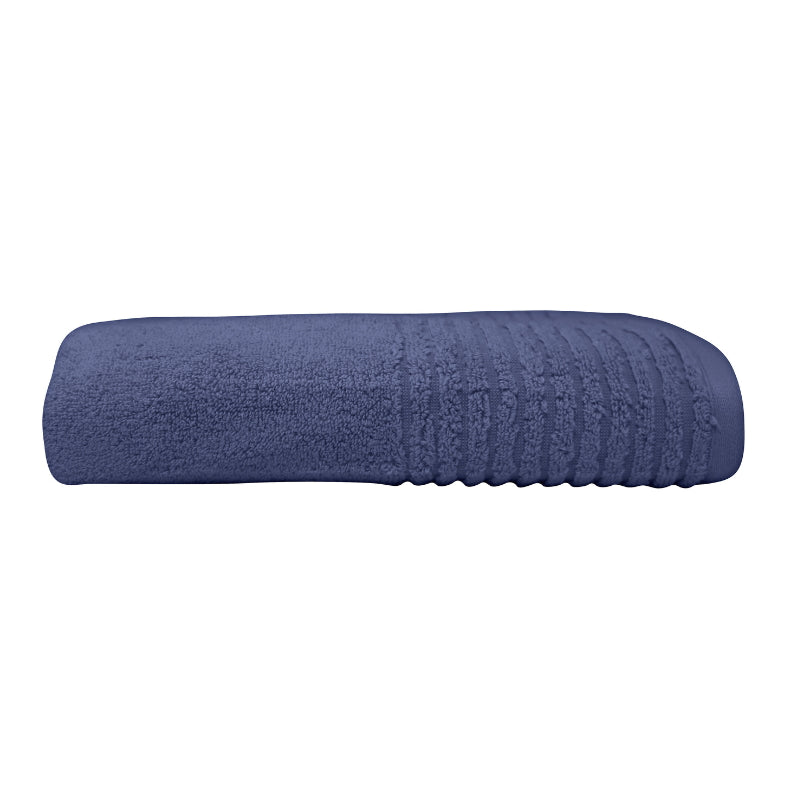 alt="A zoom-in and side photo details of a neatly folded indigo hayman bath towel showcasing its premium-quality zero twist cotton and inviting softness"