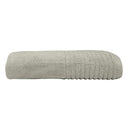 alt="A zoom-in and side photo details of a neatly folded oatmeal hayman bath towel showcasing its premium-quality zero twist cotton and inviting softness"