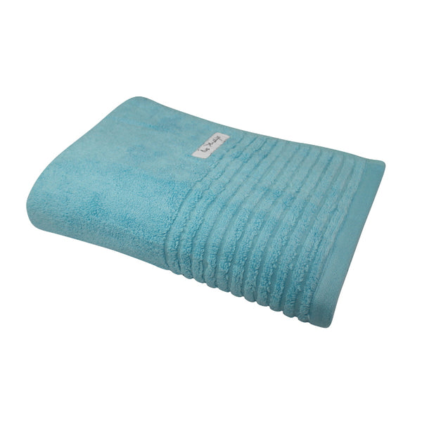 alt="A full photo details of a neatly folded ocean hayman bath towel showcasing its premium-quality zero twist cotton and inviting softness"