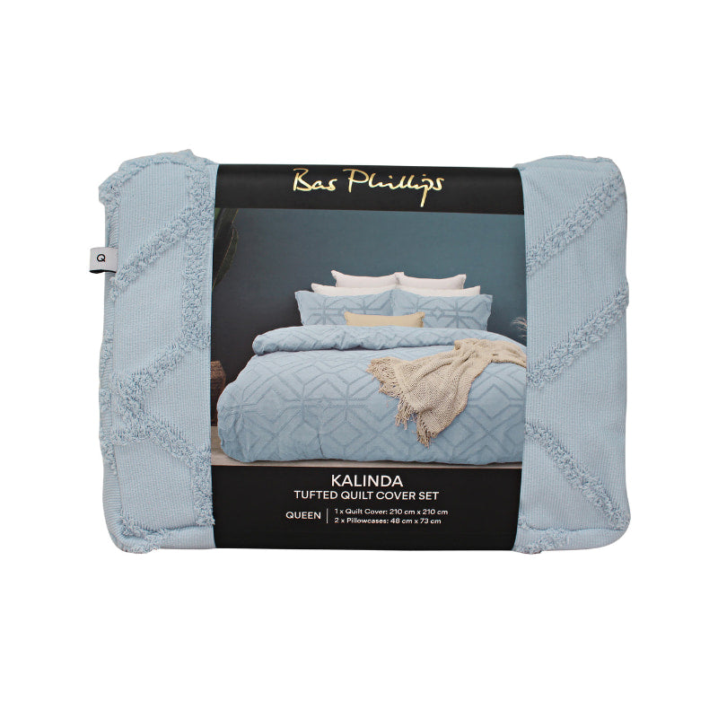 alt="Front details of a nice package of a luxurious quilt cover set in a blue hue features a captivating geometric design"