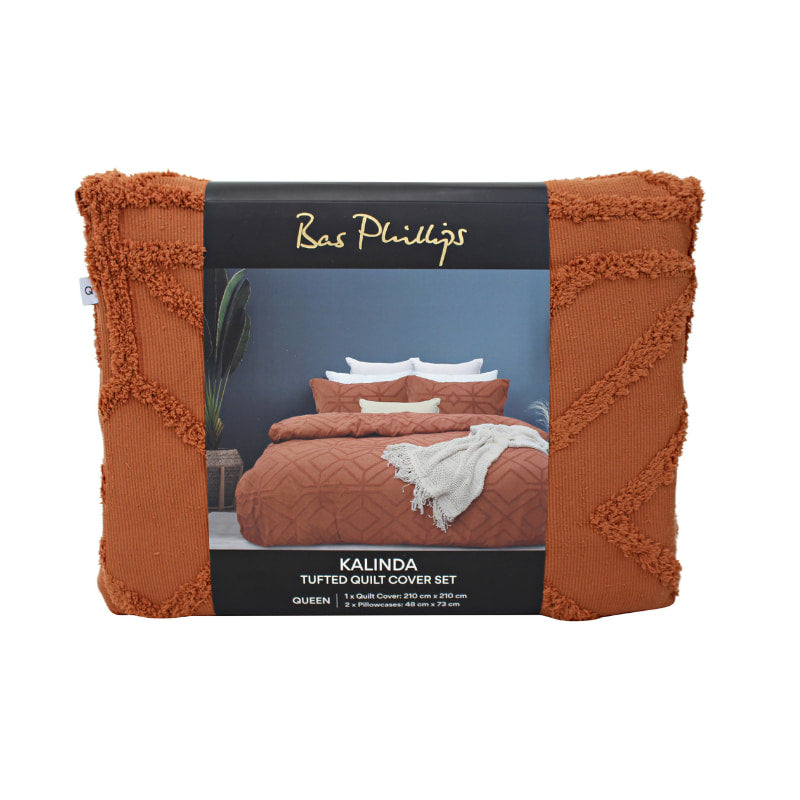 alt="Front details of a nice package of a luxurious quilt cover set in an orange hue features a captivating geometric design"