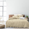 alt="Luxurious quilt cover set features a Morrocan inspired geometric pattern with tufted details"