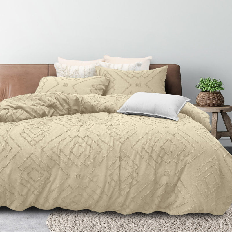 alt="Luxurious quilt cover set features a Morrocan inspired geometric pattern with tufted details"