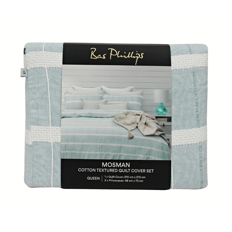 alt="Front details of a nice package of a luxurious quilt cover set in a blue hue feature an exquisite textured design."