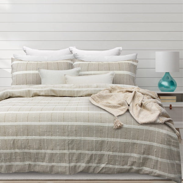 alt="Luxurious quilt cover set in a natural hue features an exquisite textured design"