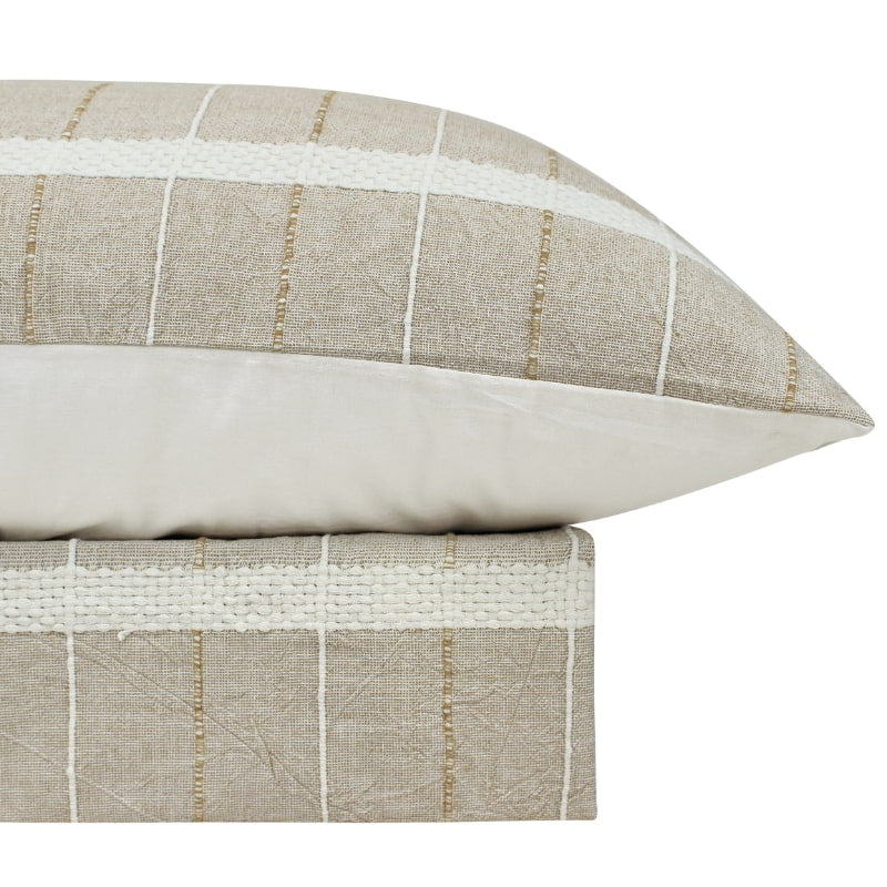 alt="A luxurious quilt cover set in a natural hue feature an exquisite textured design matching the pillowcases."