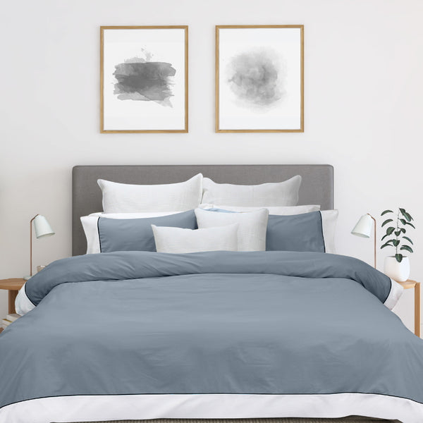 alt="Soft pure cotton quilt cover set in grey and white hues featuring an elegant border details"