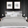 alt="Soft pure cotton quilt cover set in light grey and white hues featuring an elegant border details"