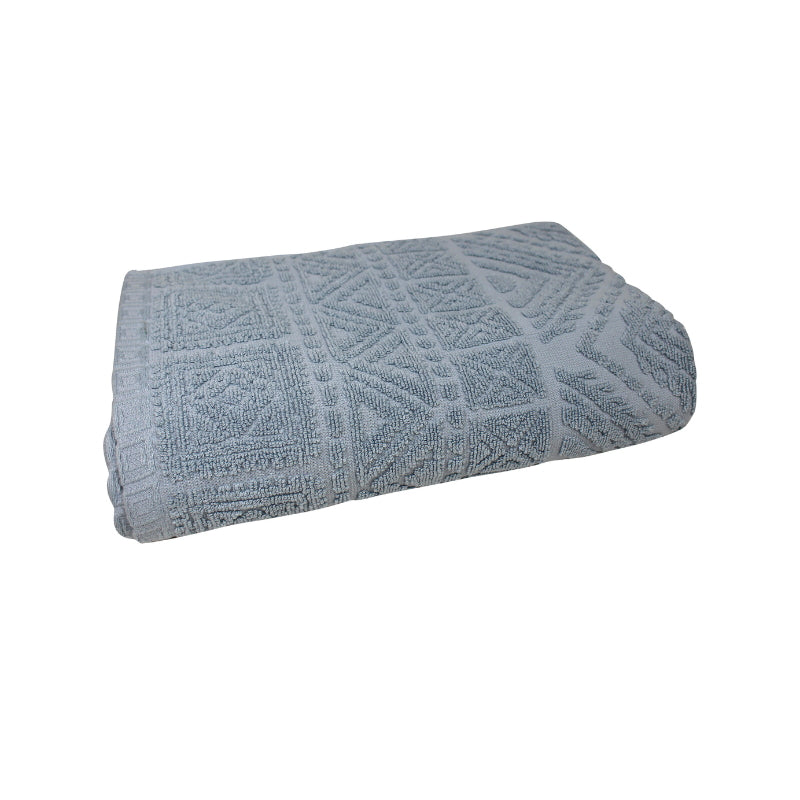 alt="A zoom-in photo of a neatly folded prussian blue persia bath towel showcasing its luxurious design"