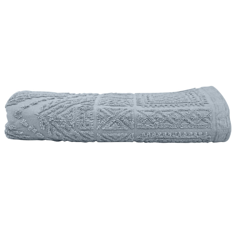 alt="A neatly folded, premium persian blue hand towel showcasing its minimalistic design and inviting softness."
